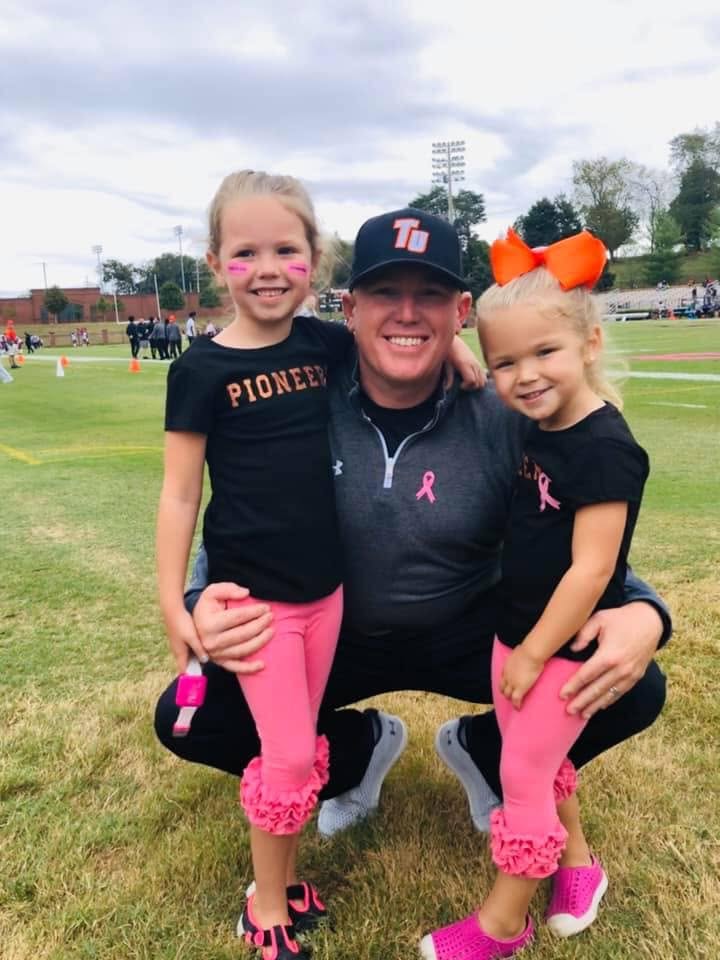 BJ Ruis with his daughters at a football game